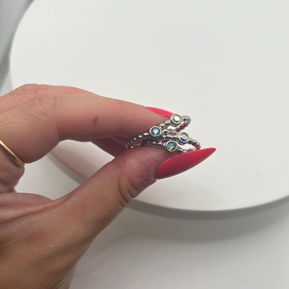 239. QUDO set of‎ 4 white gold plated over stainless steel stackable rings